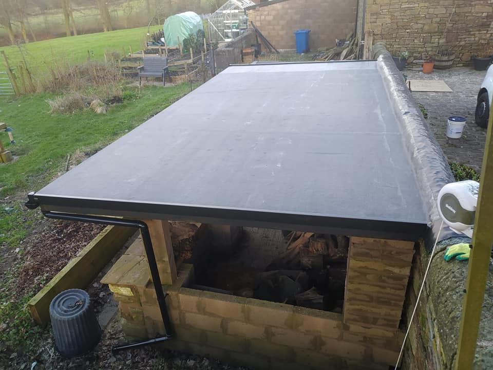 Flat roof membrane installation on a residential extension